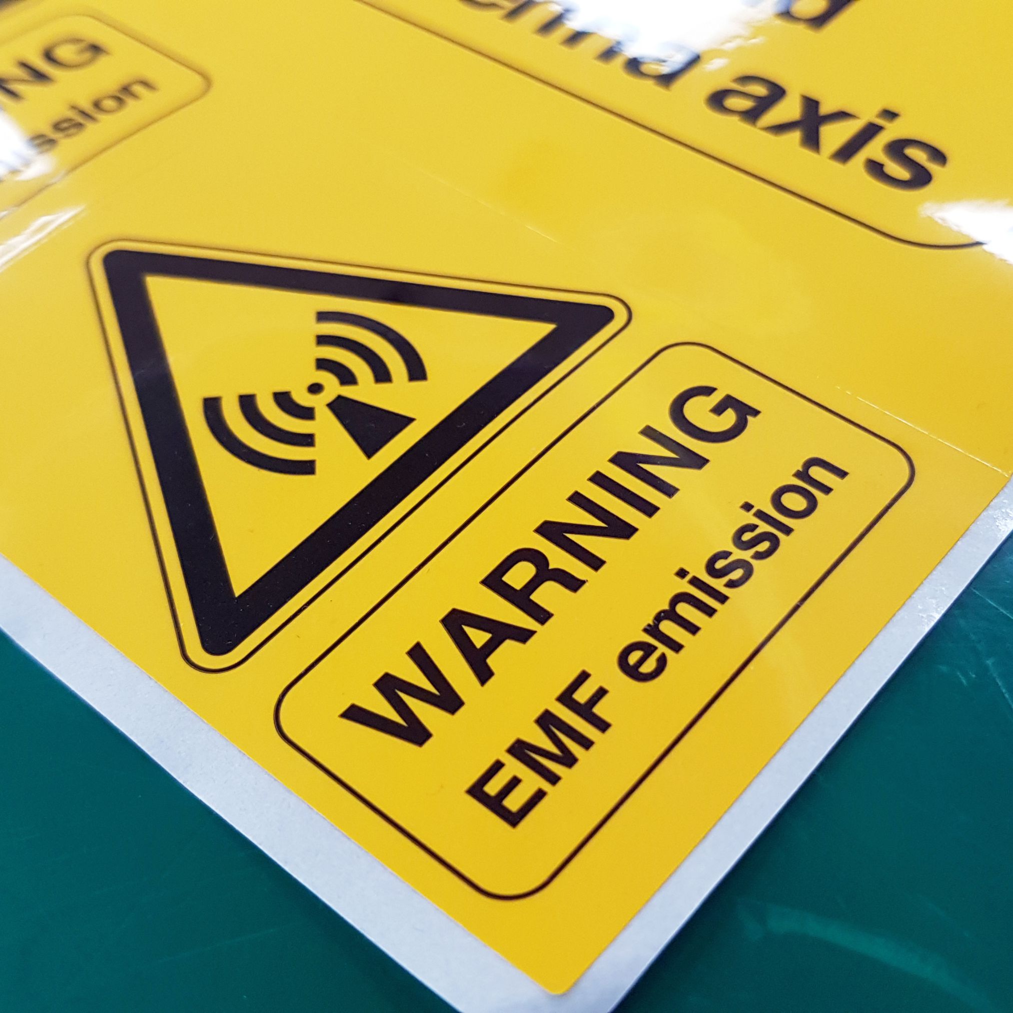 Yellow EMF emission warning labels